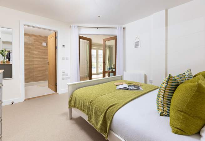 Wander through the double doors to discover the fantastic bedroom.