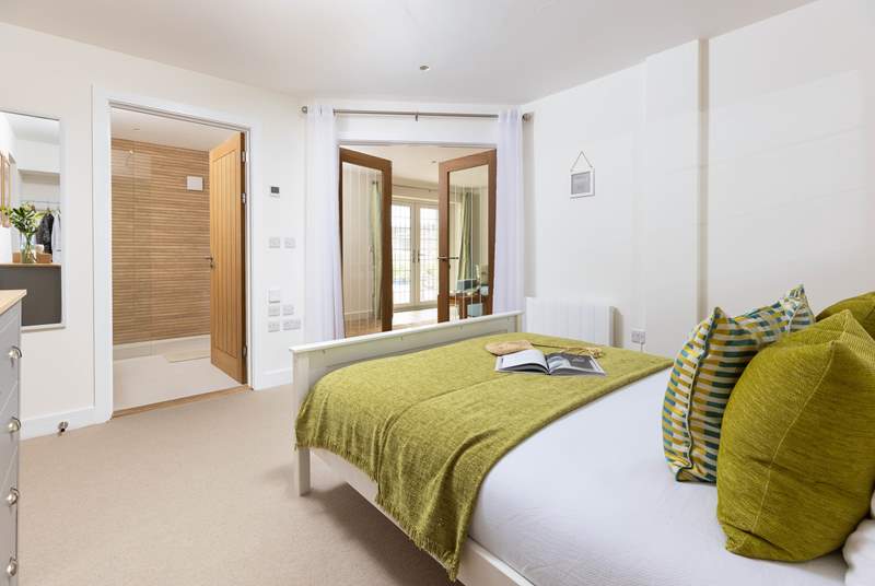 Wander through the double doors to discover the fantastic bedroom.