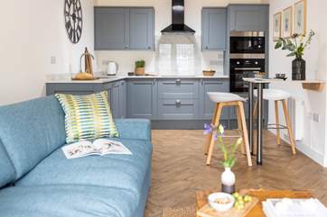 A brilliant open plan living space greets you as you enter.