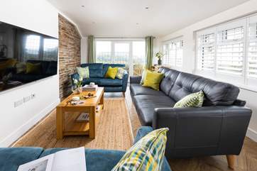 Three plush sofas offer the ideal spot to unwind in the evenings.