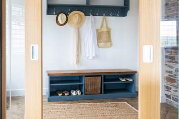 A homely entrance hall welcomes you upon your arrival.