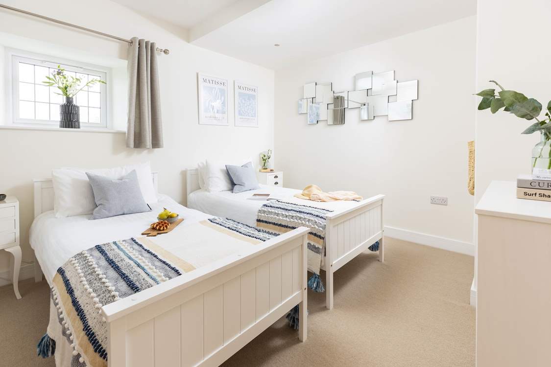 Bedroom three is home to two delightful twin beds.