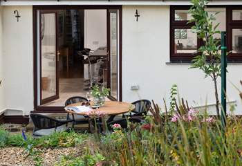 Beautiful gardens surround you at this gorgeous home.