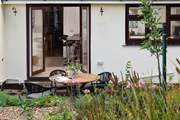 Beautiful gardens surround you at this gorgeous home.