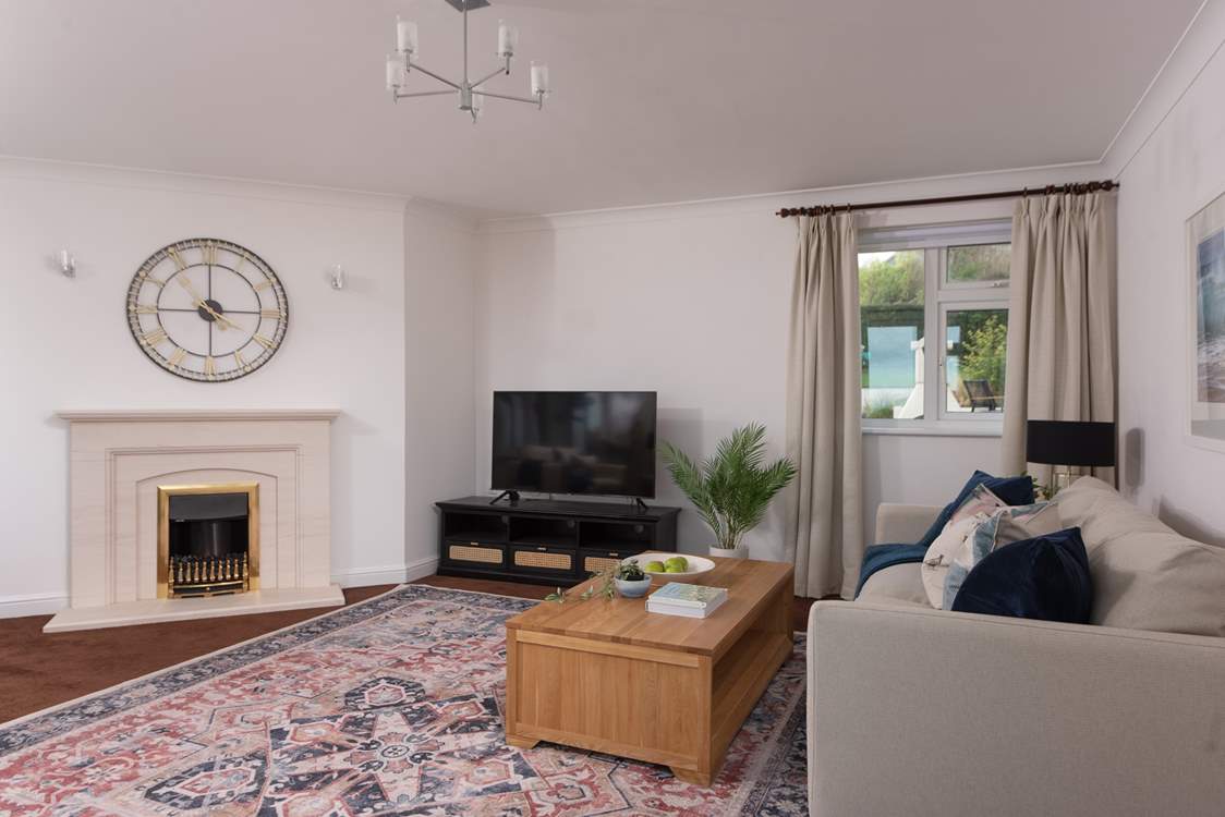 The delightful sitting-room with feature fireplace.
