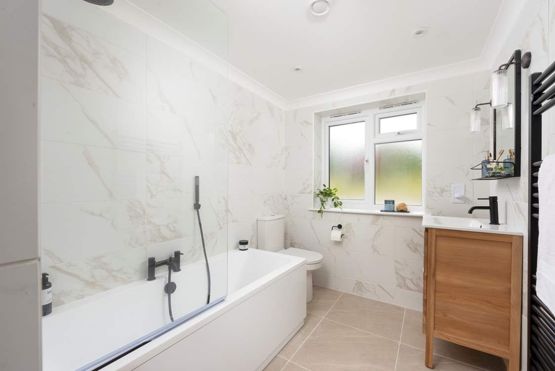 Bedroom 1 has a luxury modern en suite bathroom.
