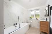 Bedroom 1 has a luxury modern en suite bathroom.