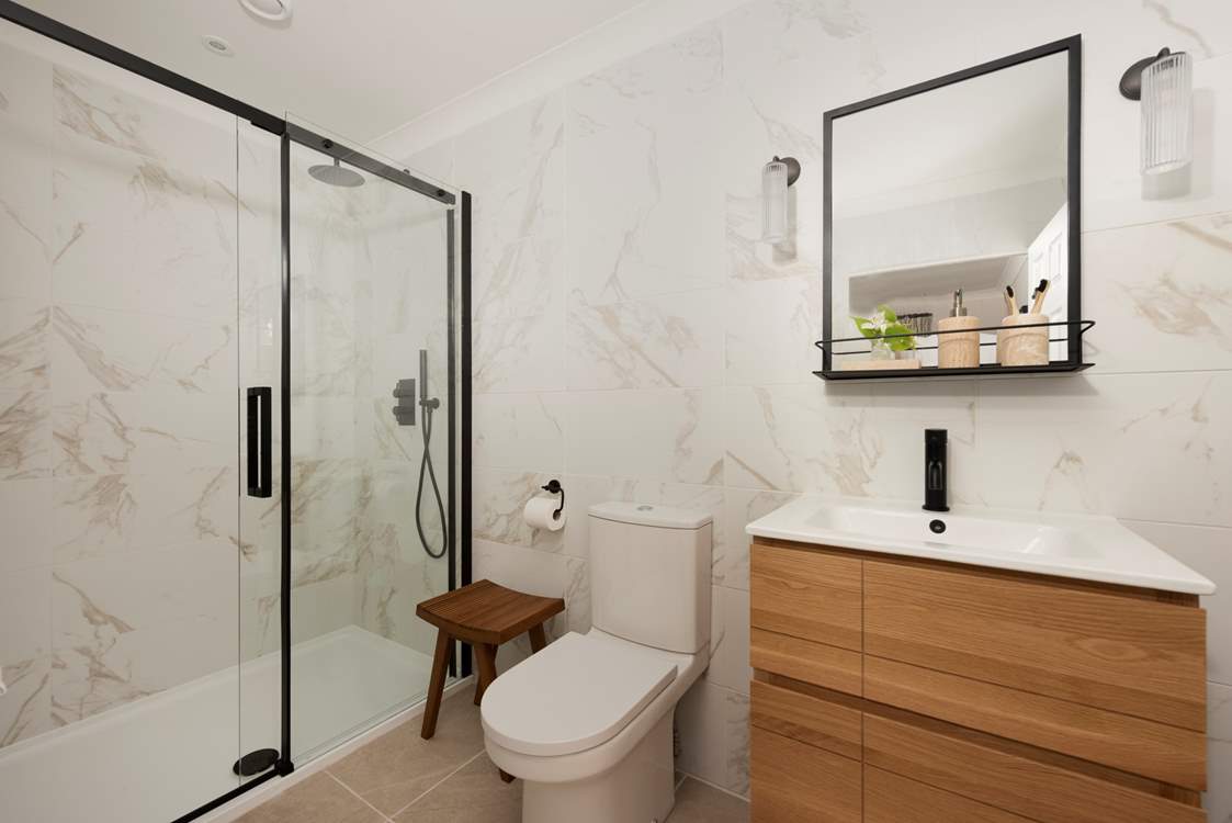 Bedroom 2 has a rainfall shower in its en suite.