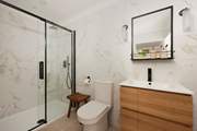 Bedroom 2  has a rainfall shower in the en suite.