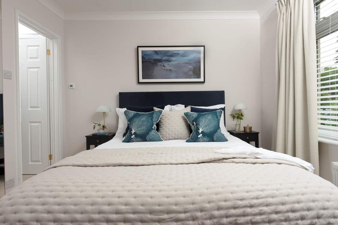 Bedroom 2 with its sumptuous bed linen, beautiful views and a luxury en suite shower-room.