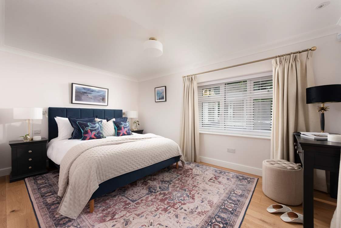 Spacious bedroom 2 with king-size bed.