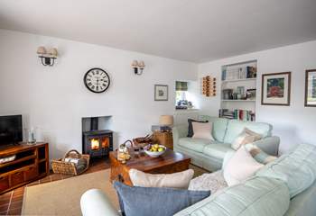 The cosy sitting-area has a gorgeous wood-burner.