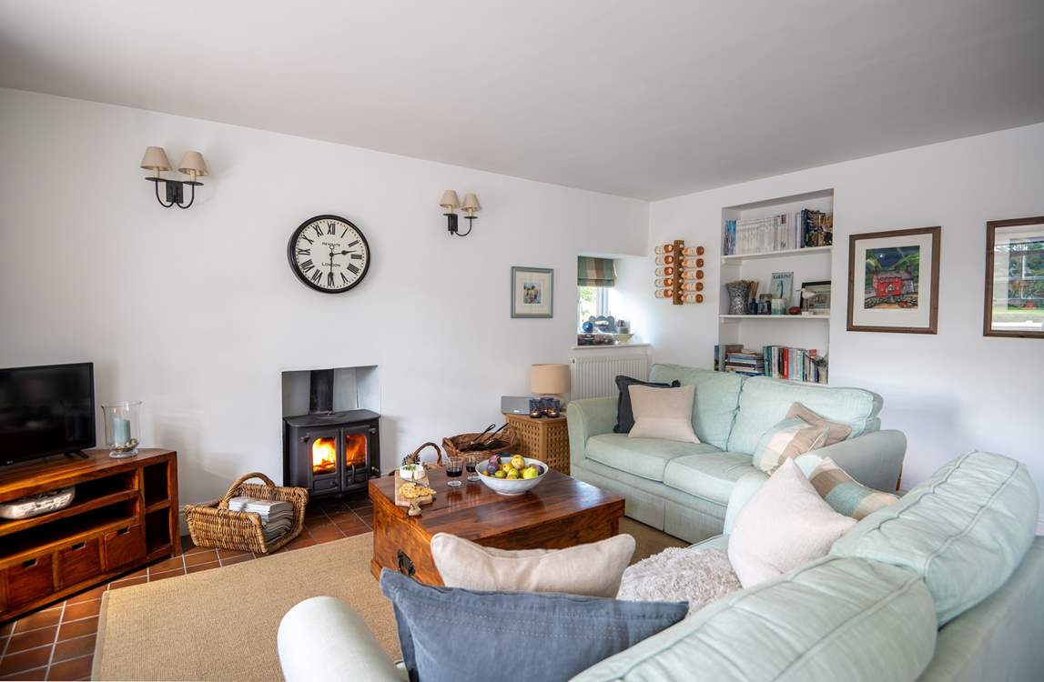 The cosy sitting-area has a gorgeous wood-burner.