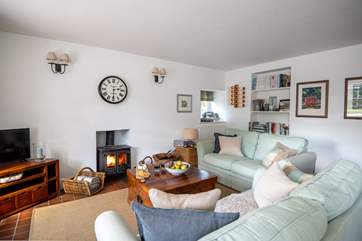 The cosy sitting-area has a gorgeous wood-burner.