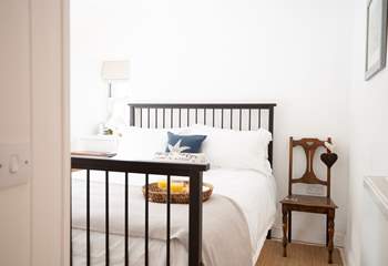 Bedroom 1 is a charming king room.