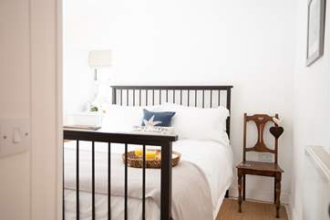 Bedroom 1 is a charming king room.