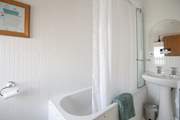 The family bathroom with fitted shower (hiding behind the curtain)
