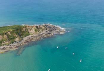 Pack a picnic and swim in the crystal clear sea. 