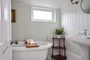 The stunning family bathroom with roll-top bath can be found on the half landing.