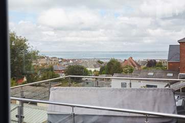 Take in the views over the Solent from the first floor bedroom. The balcony is next door.