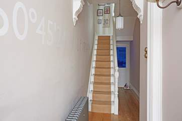 The staircase leads to the first floor.