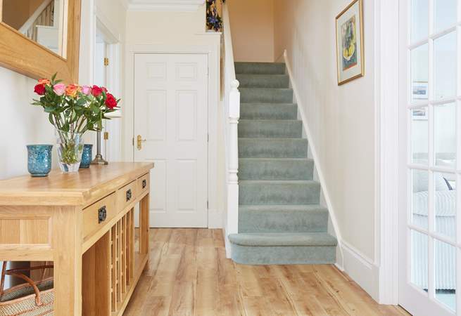The staircase leads to the first floor bedrooms and family bathroom.