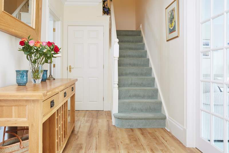 The staircase leads to the first floor bedrooms and family bathroom.