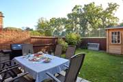 The Drey has a private back garden which overlooks the tennis court.