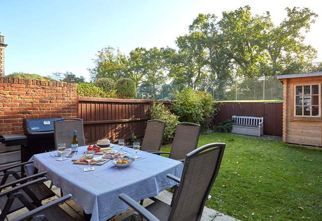 The Drey has a private back garden which overlooks the tennis court.