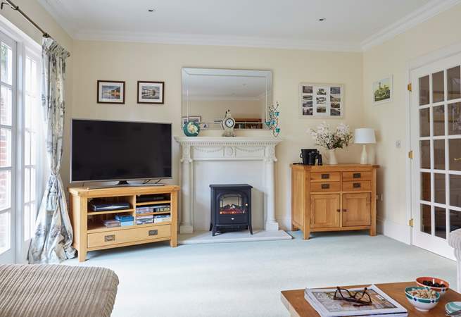 The wood-burner effect electric stove will keep you cosy in cooler months.
