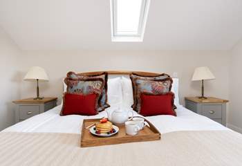 The gorgeous main bedroom has a super-king size bed for a restful night's sleep.