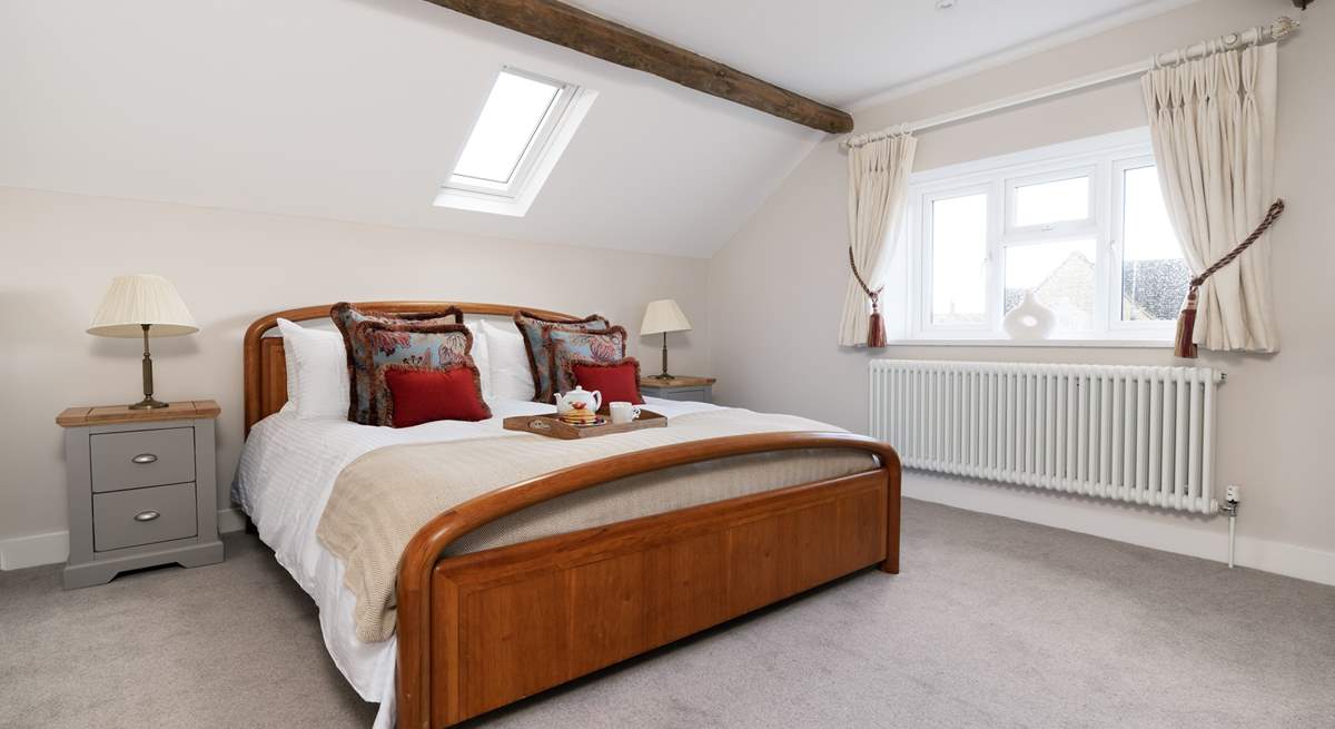 The elegant main bedroom has a super-king size bed.