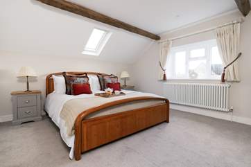 The elegant main bedroom has a super-king size bed.