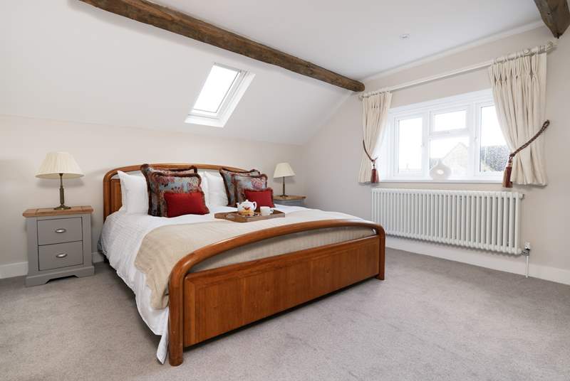 The elegant main bedroom has a super-king size bed.
