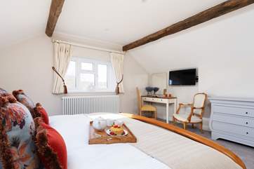 This spacious bedroom is a delight.