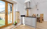 The spacious kitchen has French doors leading out to the terrace. - Thumbnail Image