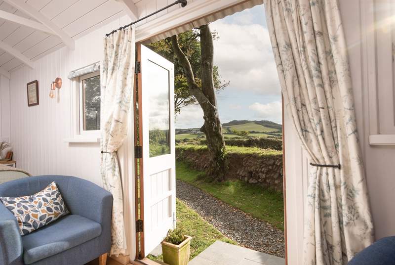 Fling open the doors and breath in those stunning views of Helman Tor.