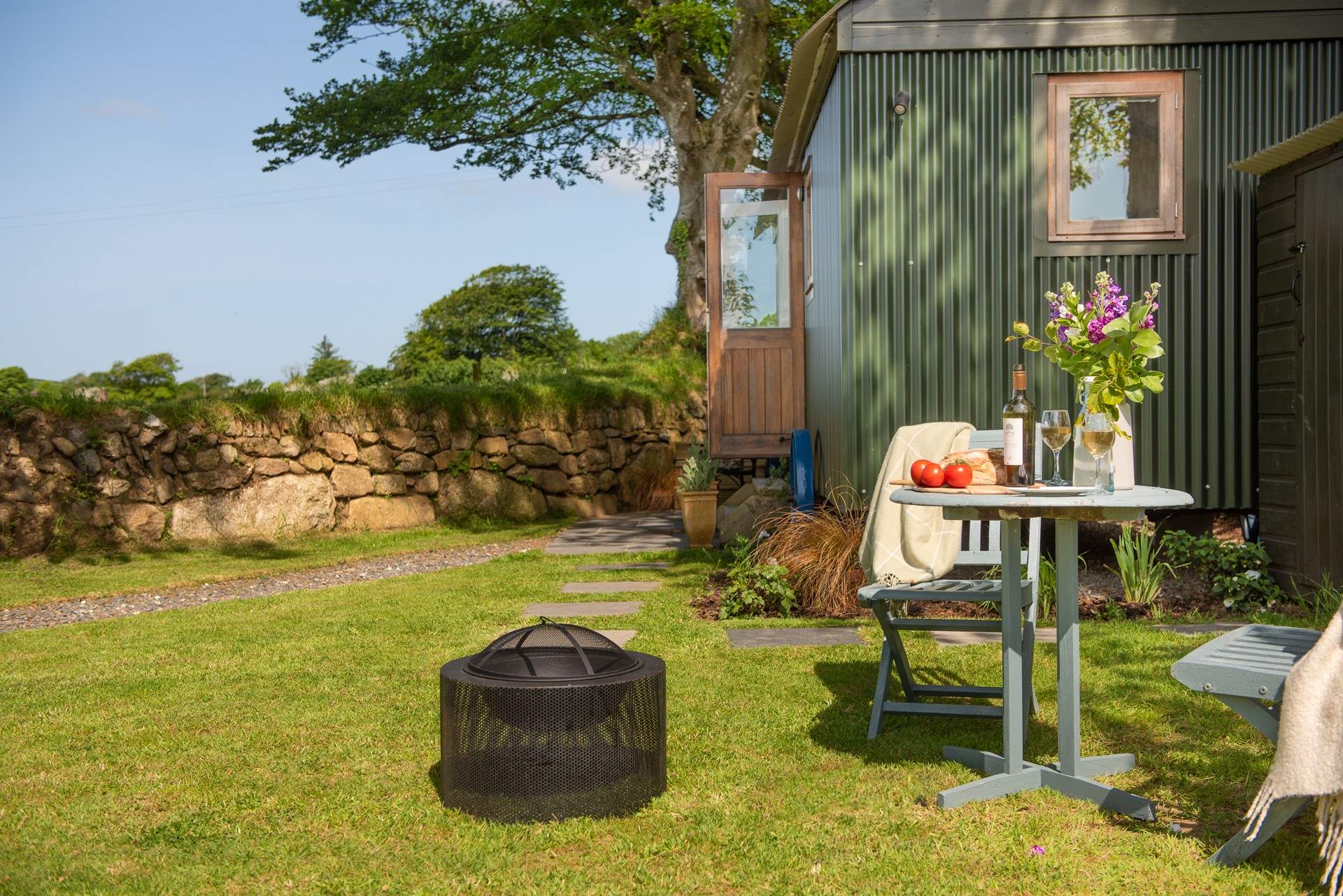 Light up the fire-pit and enjoy the sounds and sights of countryside haven.