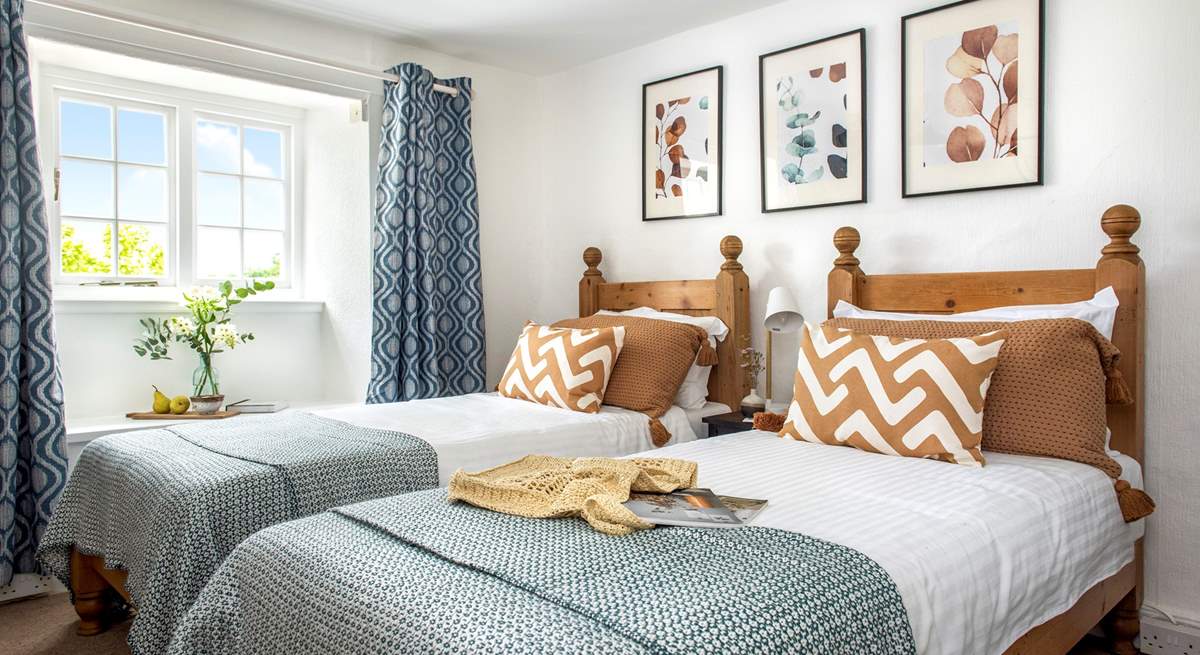 Rustic twin beds in bedroom 9.