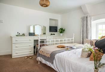A wonderfully light and airy room with plenty of storage.
