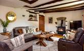 One sitting-room has a toasty wood-burner making this a perfect retreat whatever the weather. - Thumbnail Image