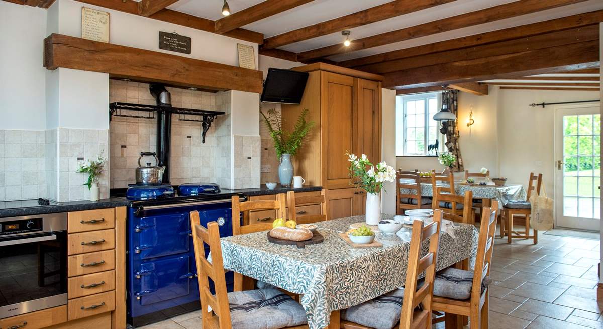 The kitchen/breakfast-room has a warming range cooker - the epitome of country living.