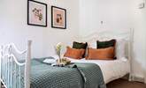 There's a pretty bedstead waiting to greet you in bedroom 8. - Thumbnail Image