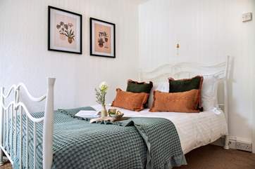 There's a pretty bedstead waiting to greet you in bedroom 8.