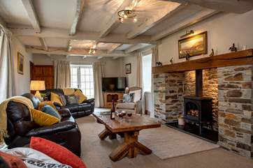 The second sitting-room has windows that lead out to the terrace and garden.