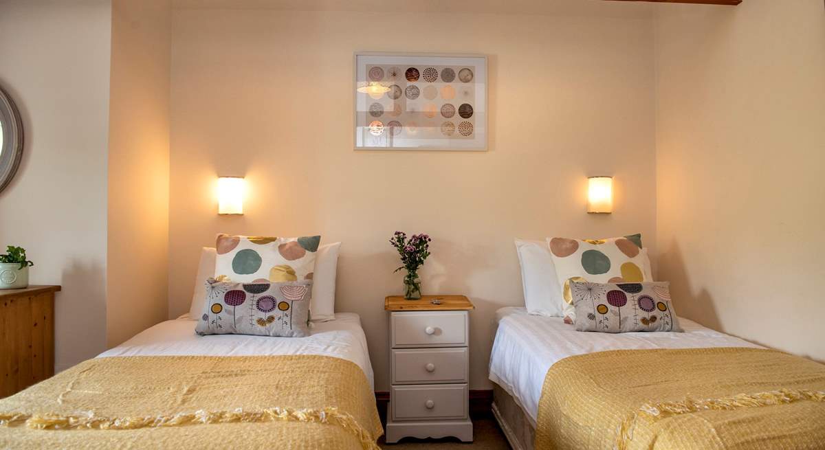 Relaxing colours in bedroom 4, this room has a 'zip and link' bed so can either be made up as twin beds or...