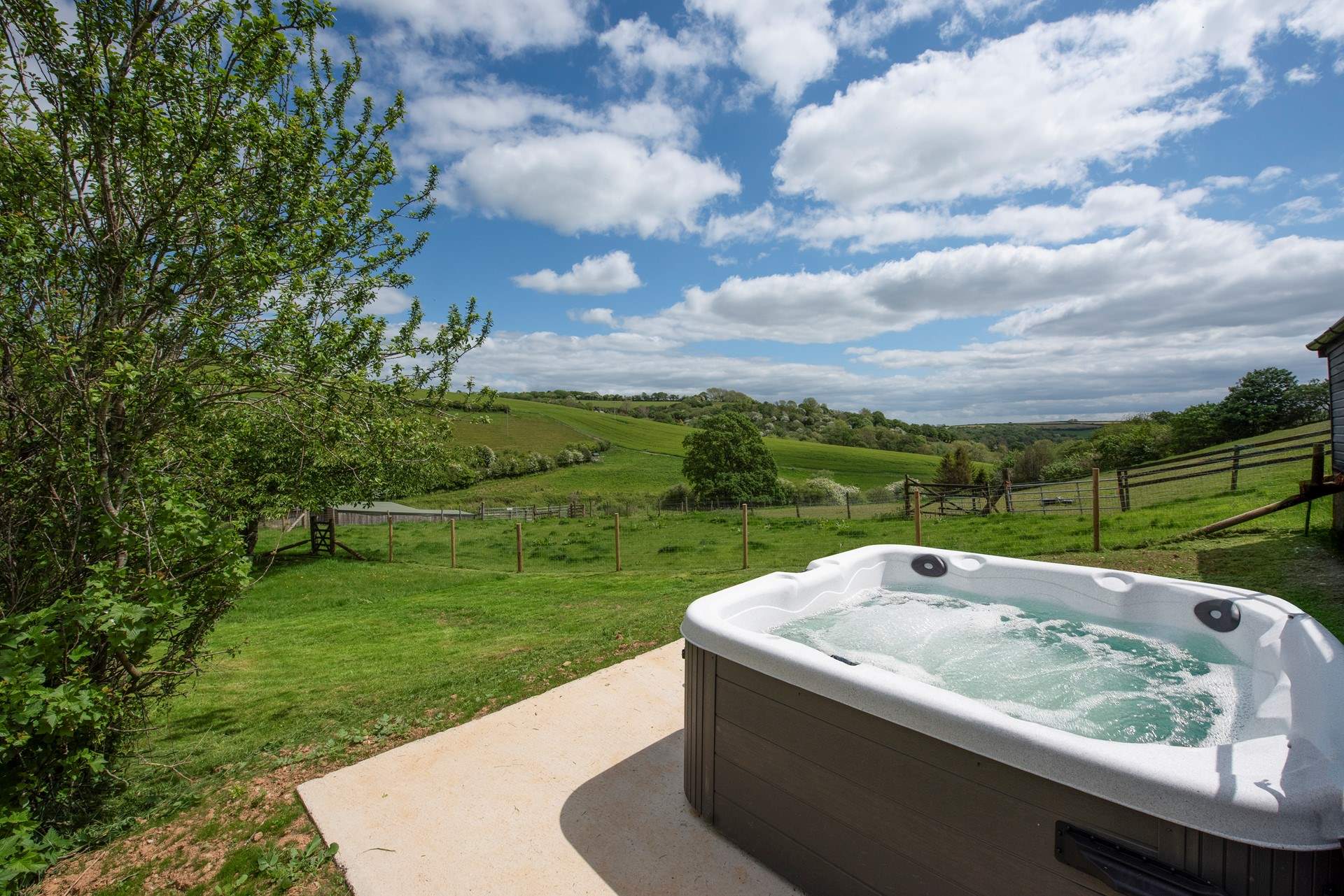 The second hot tub enjoys wonderful views across the open countryside.