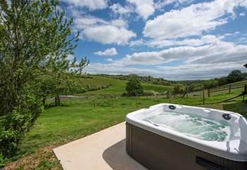 The second hot tub enjoys wonderful views across the open countryside.