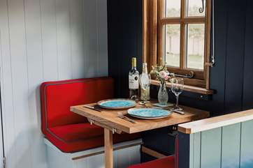 Enjoy an intimate dinner at the cute dining-table.