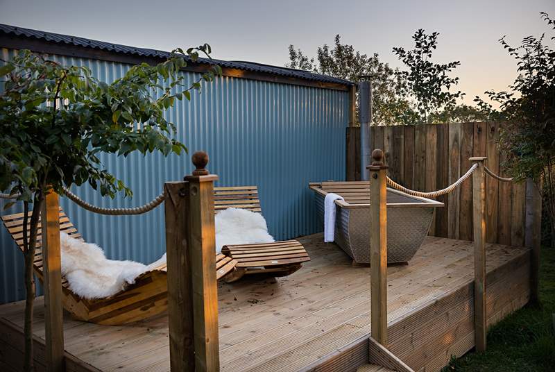 Your heavenly private decking, complete with sun loungers and quirky alfresco tub.